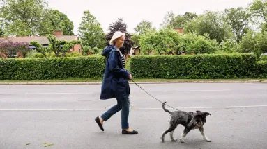 woman walking dog
