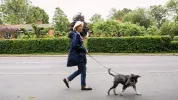 woman walking dog